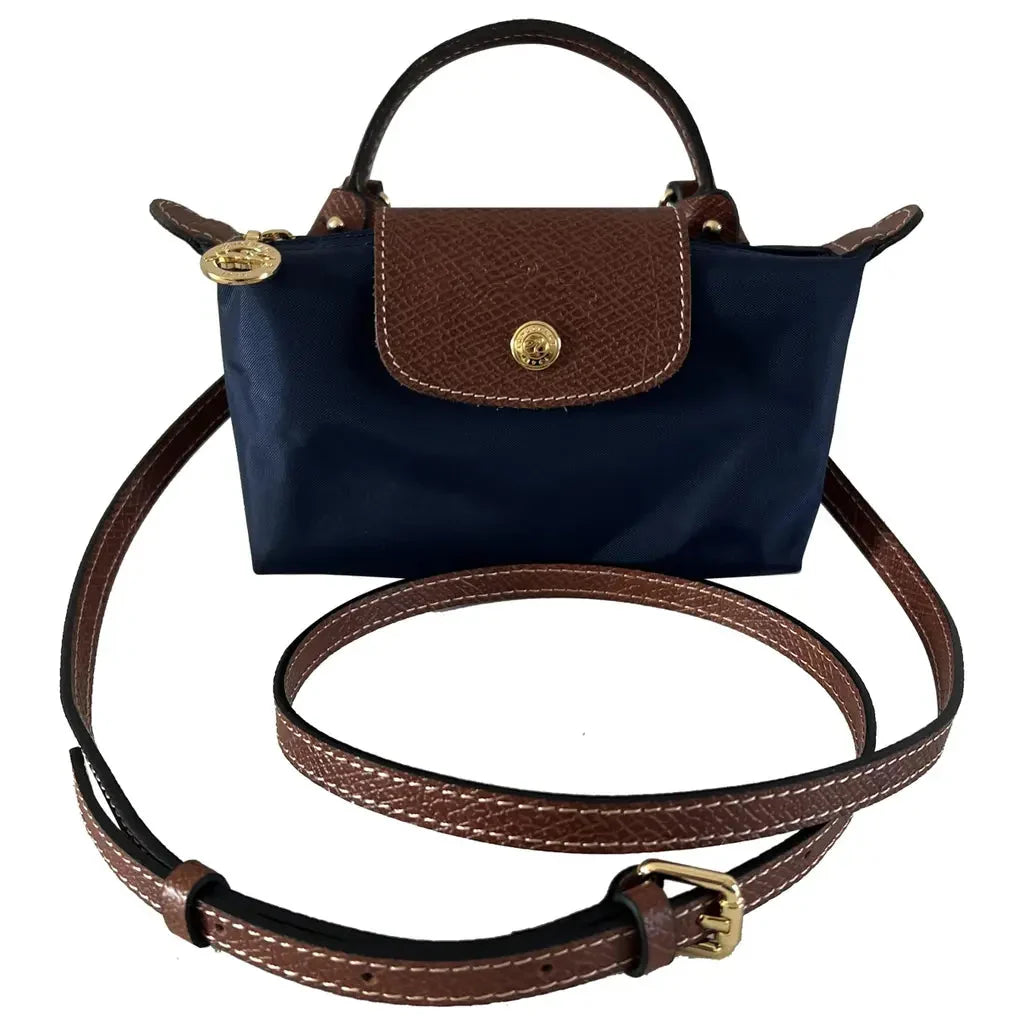 Mini bolso de hombro y cruzado de piel.