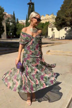 Vestido largo con escote Bardot y falda fluida.