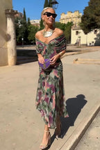 Vestido largo con escote Bardot y falda fluida.